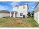 Rear view of the house and surrounding yard at 1107 Seminole Sky Dr, Ruskin, FL 33570
