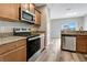 Well-equipped kitchen with stainless steel appliances and granite countertops at 1107 Seminole Sky Dr, Ruskin, FL 33570