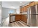 Modern kitchen featuring stainless steel appliances and granite countertops at 1107 Seminole Sky Dr, Ruskin, FL 33570