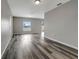 Spacious living room with gray walls and wood-look floors at 1107 Seminole Sky Dr, Ruskin, FL 33570