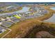 Aerial view of a house and neighborhood with lake at 11307 Linden Depot Rd, San Antonio, FL 33576