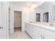 Clean bathroom with double vanity and white cabinets at 11307 Linden Depot Rd, San Antonio, FL 33576