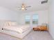 Spacious bedroom with large windows and beige carpet at 11307 Linden Depot Rd, San Antonio, FL 33576