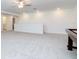 Upstairs bonus room with grey carpet and a half wall at 11307 Linden Depot Rd, San Antonio, FL 33576