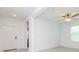 Bright entryway with white walls, light wood flooring, and ceiling fan at 11307 Linden Depot Rd, San Antonio, FL 33576