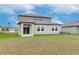Two story house exterior with backyard and landscaping at 11307 Linden Depot Rd, San Antonio, FL 33576