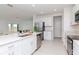 Bright kitchen featuring stainless steel appliances and an island at 11307 Linden Depot Rd, San Antonio, FL 33576