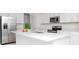 Modern kitchen with stainless steel appliances and white cabinets at 11307 Linden Depot Rd, San Antonio, FL 33576