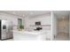 Modern kitchen with stainless steel appliances and white cabinets at 11307 Linden Depot Rd, San Antonio, FL 33576