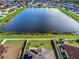 Backyard with lake view, solar panels, and gazebo at 11514 Brighton Knoll Loop, Riverview, FL 33579