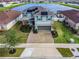 Two-story house with solar panels and a paved driveway at 11514 Brighton Knoll Loop, Riverview, FL 33579