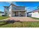 Large backyard with patio and lush green lawn at 11514 Brighton Knoll Loop, Riverview, FL 33579