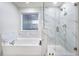 Elegant bathroom with soaking tub and walk-in shower at 11514 Brighton Knoll Loop, Riverview, FL 33579