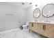 Modern bathroom with double vanity and marble floors at 11514 Brighton Knoll Loop, Riverview, FL 33579
