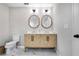 Modern bathroom with double vanity and marble floors at 11514 Brighton Knoll Loop, Riverview, FL 33579