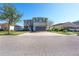 Two-story house with gray siding, solar panels, and a two-car garage at 11514 Brighton Knoll Loop, Riverview, FL 33579
