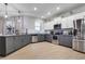 Modern kitchen with stainless steel appliances and gray cabinets at 11514 Brighton Knoll Loop, Riverview, FL 33579