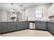 Modern kitchen featuring gray cabinets and granite countertops at 11514 Brighton Knoll Loop, Riverview, FL 33579