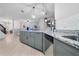 Modern kitchen with a large island, granite countertops and stainless steel appliances at 11514 Brighton Knoll Loop, Riverview, FL 33579