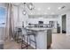 Kitchen island with seating overlooking the main kitchen at 11514 Brighton Knoll Loop, Riverview, FL 33579