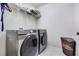 Laundry room with washer, dryer, and shelving at 11514 Brighton Knoll Loop, Riverview, FL 33579