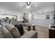 Spacious living room with sectional sofa and wood-look floors at 11514 Brighton Knoll Loop, Riverview, FL 33579