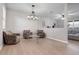 Light and airy living room with two armchairs and a glass coffee table at 11514 Brighton Knoll Loop, Riverview, FL 33579