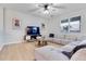 Living room with sectional sofa and large TV at 11514 Brighton Knoll Loop, Riverview, FL 33579