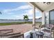 Relaxing patio with brick pavers and wicker furniture at 11514 Brighton Knoll Loop, Riverview, FL 33579