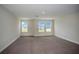 Large bedroom with carpet and multiple windows at 12140 Cattleside Dr, Riverview, FL 33579