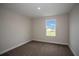 Well-lit bedroom featuring carpet and a window at 12140 Cattleside Dr, Riverview, FL 33579