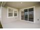 Covered patio with sliding glass doors leading inside at 12140 Cattleside Dr, Riverview, FL 33579