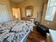 Guest bedroom with wood floors and dresser at 12411 Cavalier Ct, Hudson, FL 34669