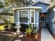 Front yard with landscaping, walkway, and a fountain near the entrance at 12411 Cavalier Ct, Hudson, FL 34669