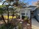 Landscaped front yard with fountain and walkway at 12411 Cavalier Ct, Hudson, FL 34669