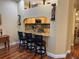 Kitchen features granite countertops, modern appliances, and a breakfast bar with seating at 12411 Cavalier Ct, Hudson, FL 34669
