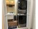 Convenient laundry room with stackable washer and dryer at 12411 Cavalier Ct, Hudson, FL 34669
