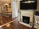 Living room with fireplace and hardwood floors at 12411 Cavalier Ct, Hudson, FL 34669