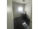 Small bedroom with desk, chair, and window at 12411 Eagle Lake Ave, New Port Richey, FL 34654