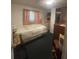 Bedroom with double bed, dresser, and closet at 12411 Eagle Lake Ave, New Port Richey, FL 34654