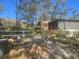 Home with a chain link fence and gated entry at 12411 Eagle Lake Ave, New Port Richey, FL 34654