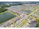 Aerial view of community with multiple houses and lakes at 12854 Boggy Creek Dr, Riverview, FL 33579