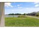 Lovely backyard with a lake view and walkway at 12854 Boggy Creek Dr, Riverview, FL 33579