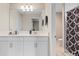 Bathroom with white vanity, mirror, and shower/tub combo at 12854 Boggy Creek Dr, Riverview, FL 33579