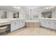 Spa-like bathroom with double vanity, large soaking tub, and shower at 12854 Boggy Creek Dr, Riverview, FL 33579
