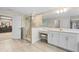 Modern bathroom with walk-in shower, vanity, and sitting area at 12854 Boggy Creek Dr, Riverview, FL 33579