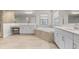 Elegant bathroom with double vanity, soaking tub, and walk-in shower at 12854 Boggy Creek Dr, Riverview, FL 33579