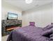 Bedroom featuring a fireplace and a large TV at 12854 Boggy Creek Dr, Riverview, FL 33579