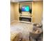 Bedroom with modern fireplace and wall-mounted TV at 12854 Boggy Creek Dr, Riverview, FL 33579