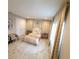 Elegant bedroom with a king-size bed and soft rug at 12854 Boggy Creek Dr, Riverview, FL 33579
